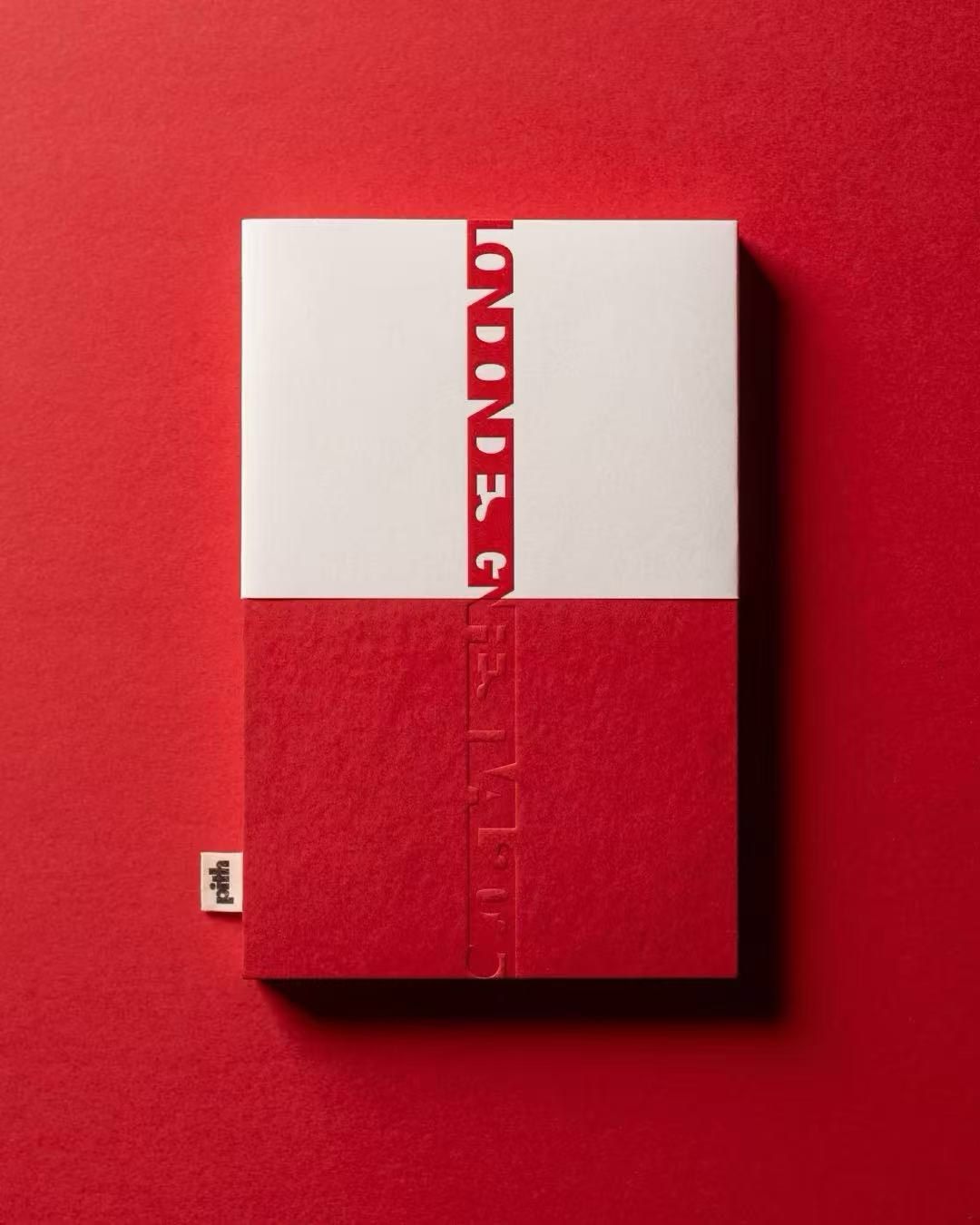 A red and white presentation gift box on a red background