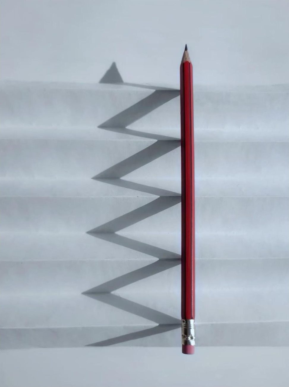 The everyday problem: a sharpened pencil and nowhere safe to put it.